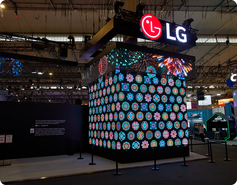 A close-up of the three-sided LED tower showcases the massive scale and vibrant digital patterns of LG's showstopping entrance.